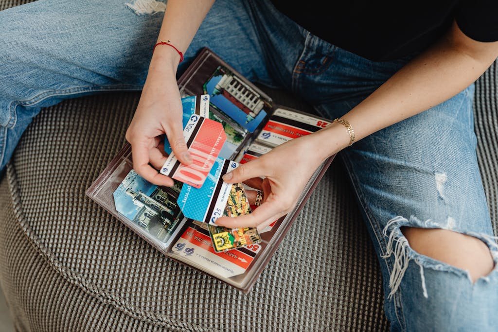 Close-up of a Person Holding a Bunch of Credit Cards